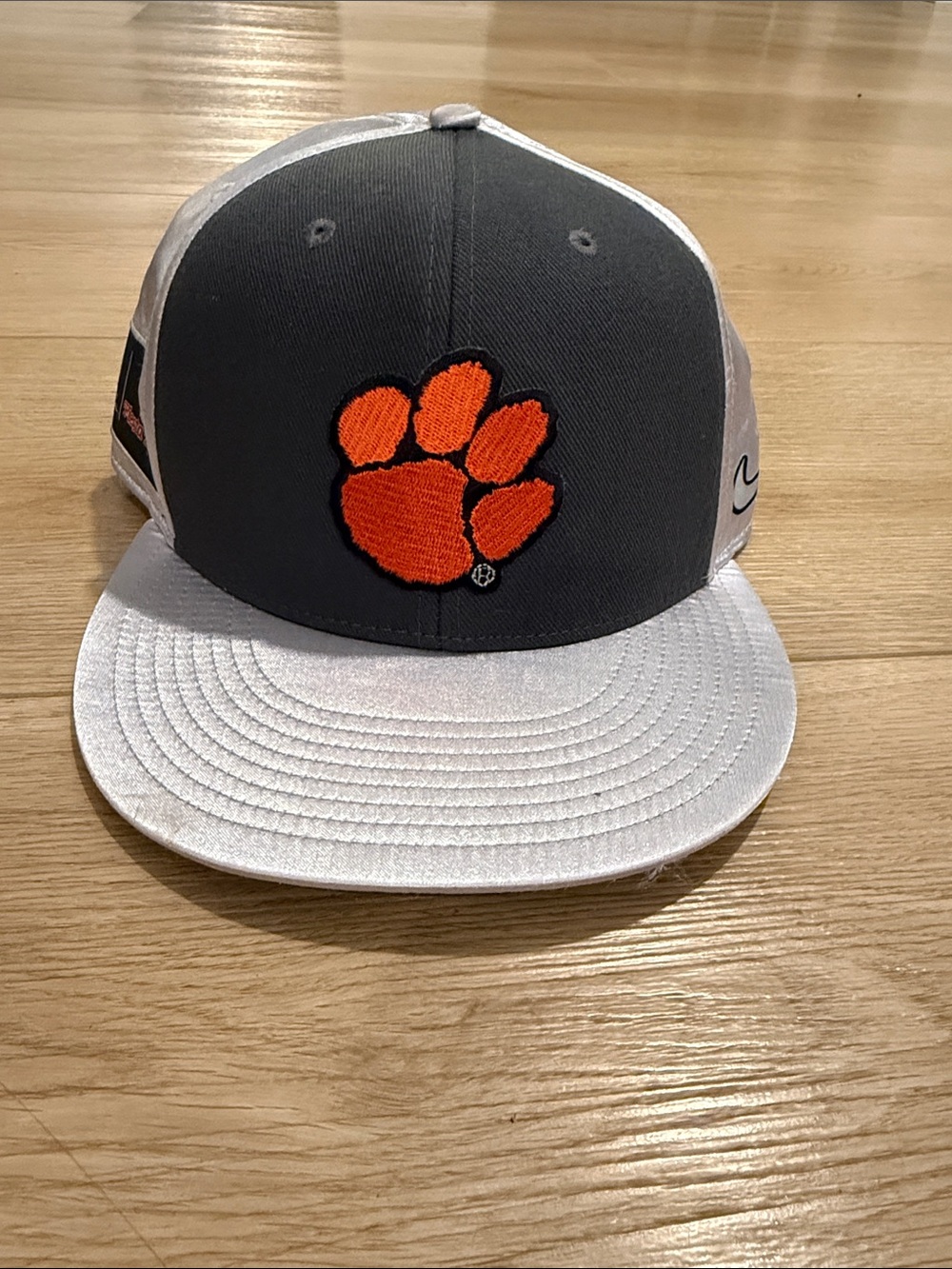 Nike Gray and White Hat with Orange Paw Logo